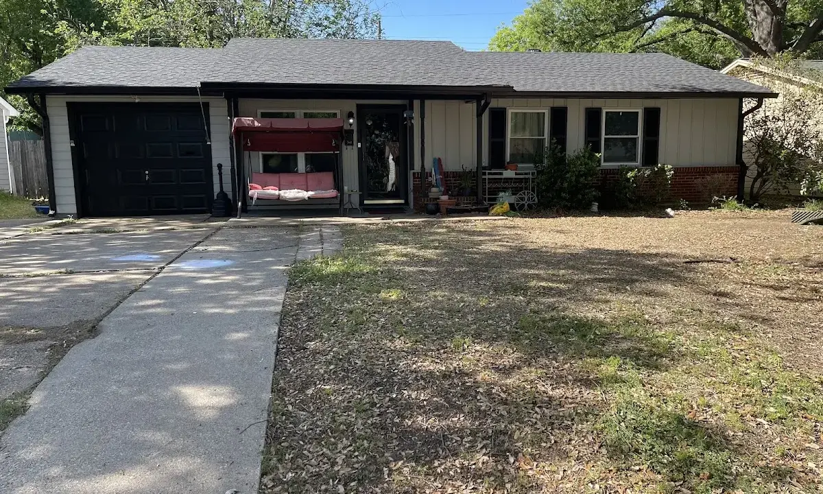 Asphalt Shingle Roof Repair crew at work on a residential roof in Whiskey Creek